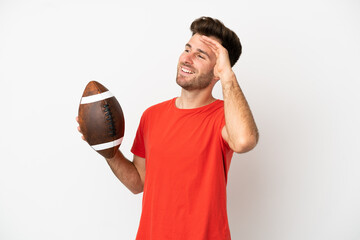 Young caucasian man playing rugby isolated on white background smiling a lot