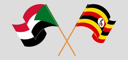 Crossed and waving flags of the Sudan and Uganda