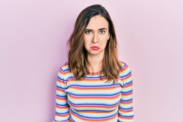 Fototapeta premium Young hispanic girl wearing casual clothes depressed and worry for distress, crying angry and afraid. sad expression.