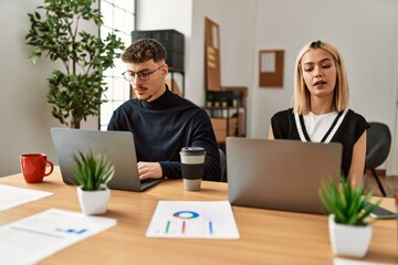 Two business workers working concentrated at the office.