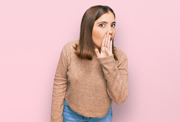 Young beautiful woman wearing casual clothes hand on mouth telling secret rumor, whispering...