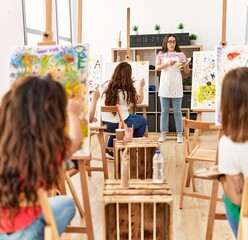 Group of women having paint class at art studio.