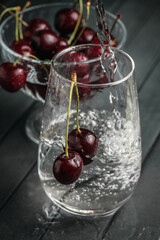 Fresh juicy cherries. Red cherry on a dark background. Macro photo.