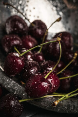 juicy ripe cherry close-up. Red cherry. macro photo. Still life on a dark background.