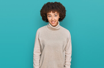 Fototapeta na wymiar Young hispanic girl wearing wool winter sweater with a happy and cool smile on face. lucky person.