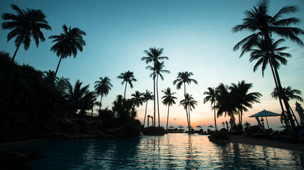 Fototapeta na wymiar View of tropical palm beach during beautiful sky twilight.