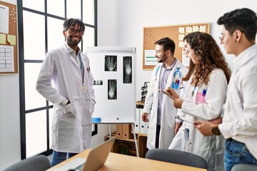Fototapeta premium Group of young doctor people discussing in a medical meeting at the clinic office.
