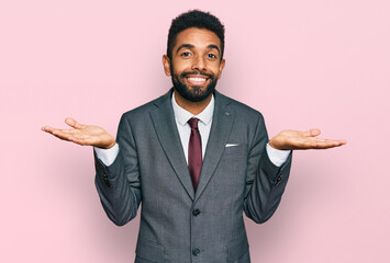 Young african american man wearing business clothes clueless and confused expression with arms and...