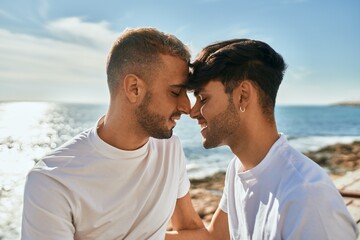Romantic gay couple at the beach.