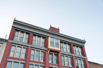 Fototapeta premium Low angle view of a red building with unique design and structure at Tacoma, Washington