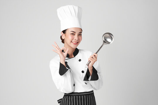 Beautiful Young Asian Woman Chef On White Background