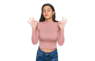 Young hispanic girl wearing casual clothes relax and smiling with eyes closed doing meditation gesture with fingers. yoga concept.
