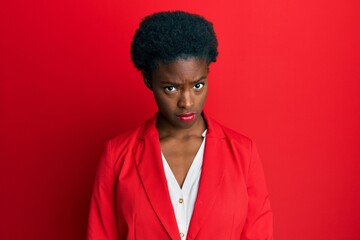 Fototapeta na wymiar Young african american girl wearing business clothes skeptic and nervous, frowning upset because of problem. negative person.
