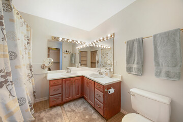 Bathroom interior with L-shaped double vanity sink