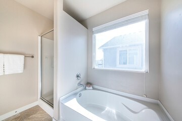 Interior of a bathroom with a view of neighbor's house
