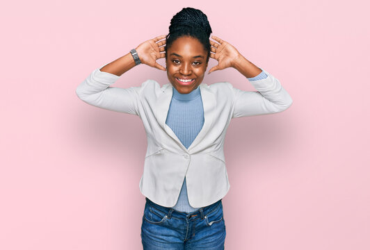 Young african american woman wearing business clothes relaxing and stretching, arms and hands behind head and neck smiling happy