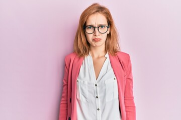 Young caucasian woman wearing business style and glasses depressed and worry for distress, crying angry and afraid. sad expression.