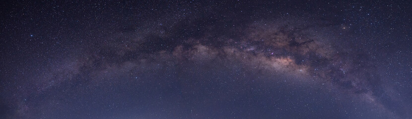 Panorama purple and blue night sky milky way and star on dark background.with noise and  grain.Photo by long exposure and select white balance.