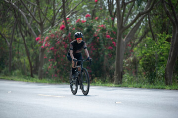 Naklejka premium Asian woman are cycling road bike in the morning