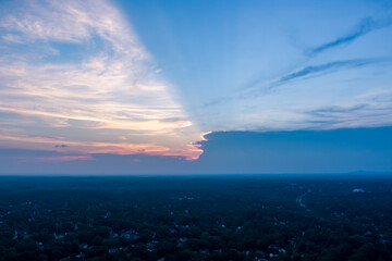 The sun sets behind storm clouds, taken above Rockville, Montgomery County, Maryland