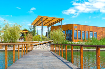 Wooden bridge across the lake leading to the recreation area