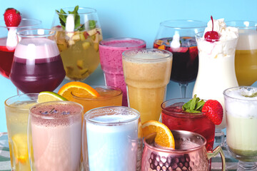 Cocktail set, summer drinks over blue background. Group of different alcoholic beverages over blue.