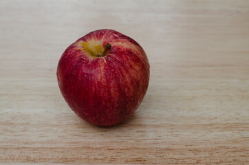 red apple on wooden table
