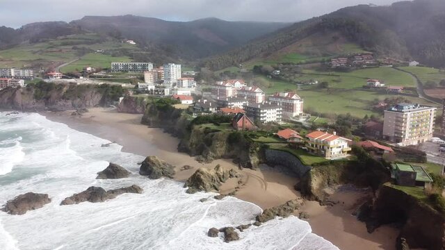 Aerial drone view of the beach of Bakio in the Basque Country in a foggy day