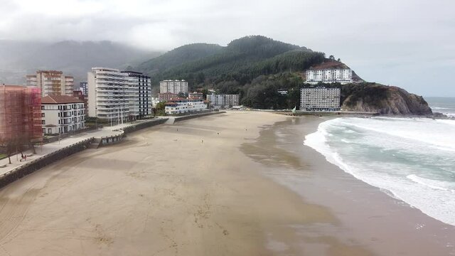 Aerial drone view of the beach of Bakio in the Basque Country in a foggy day