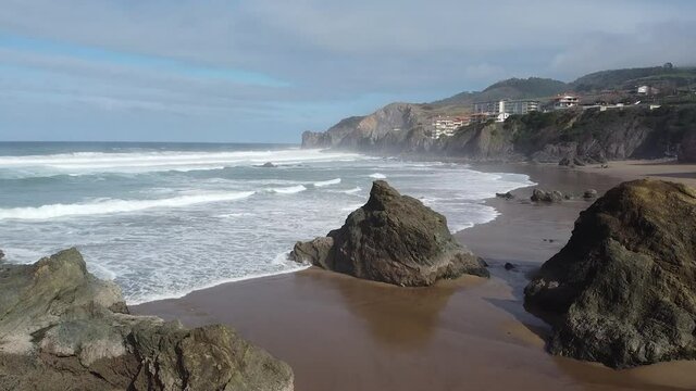Aerial drone view of the beach of Bakio in the Basque Country in a foggy day