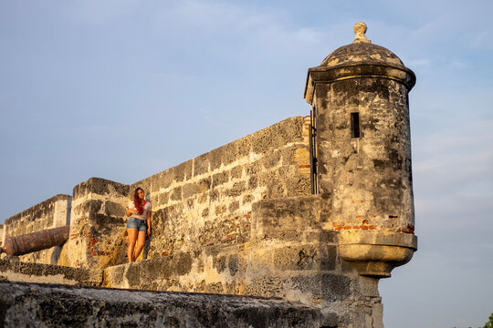 Woman on the wall of the old city of Cartagena Colombia