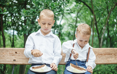 boys eats a birthday cake 