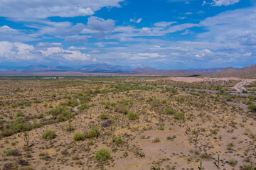 Fototapeta premium Aerial view of remote desert highway landscape in northern mountains Arizona, USA