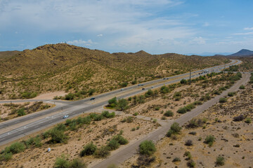 Aerial view highway across the arid desert Arizona mountains adventure traveling desert road