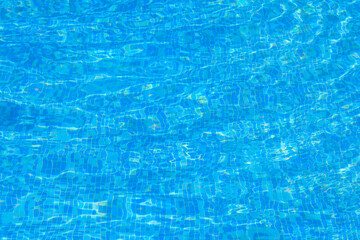 Texture of water in swimming pool for background. Surface of blue swimming pool