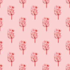 Seamless pattern with ice cream on wooden stick or popsicle from  pink flowers of hydrangea. Summer minimal concept.
