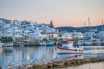 Fototapeta na wymiar Iconic view from the picturesque seaside village of Naousa in the island of Paros, Cyclades, Greece, during summer period