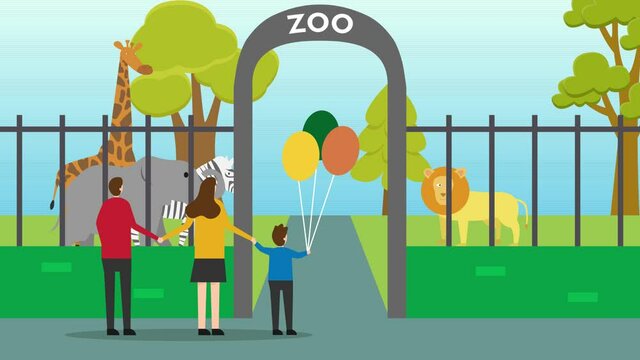 Happy family looking animals at the zoo