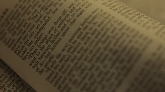 close up pages flipping bible book on the table