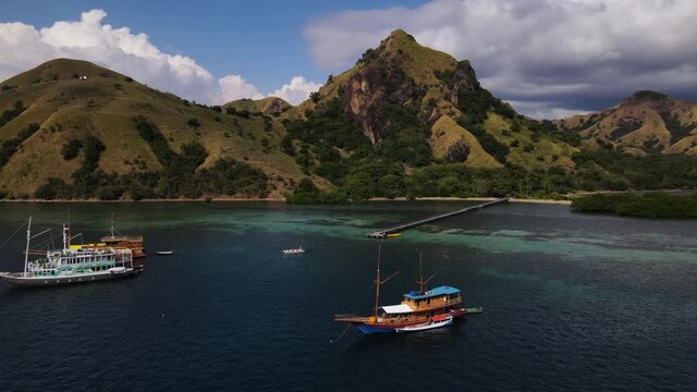 Yachts And Passenger Boats At The Flores Sea On Tour Of Komodo Island In East Indonesia. aerial