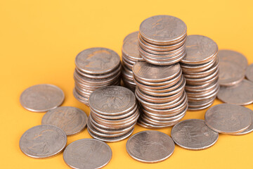 A pile of coins on blue background
