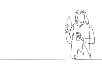 Single continuous line drawing young Arab man holding bottle in one hand and glass of orange juice in the other while having breakfast at home. Dynamic one line draw graphic design vector illustration