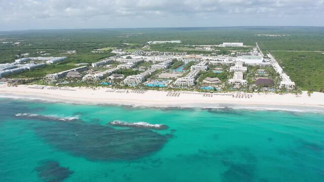 Hard Rock Hotel and surrounding landscape, Punta Cana. Aerial forward descending