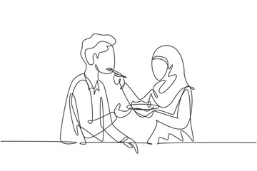 Continuous one line drawing romantic Arabian woman feeds her husband. Happy couple dinner together at restaurant. Celebrate wedding anniversaries. Single line draw design vector graphic illustration