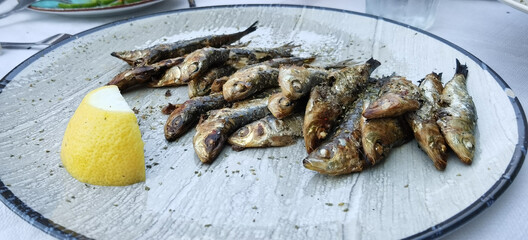 grilled sardines  on the table in  a plate  in Preveza