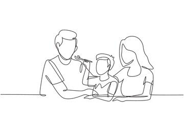 Continuous one line drawing young family having fun together in modern restaurant. Boy feeds his father with love. Happy little family concept. Single line draw design vector graphic illustration