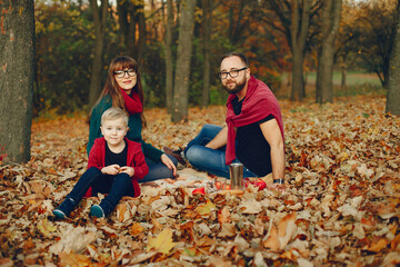 Family with little son in a autumn park