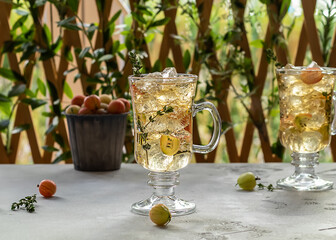 Summer gooseberry ice tea with thymes. Homemade non-alcoholic mocktail
