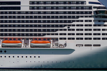 Gigantic MSC cruiseship cruise ship liner Grandiosa in port of Valletta, Malta with other maritime...