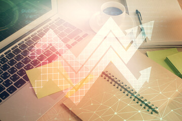 Double exposure of arrows drawing and desktop with coffee and items on table background. Concept of growth.